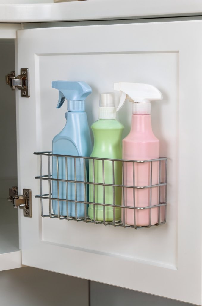 cabinet door organizer basket storing cleaning supplies